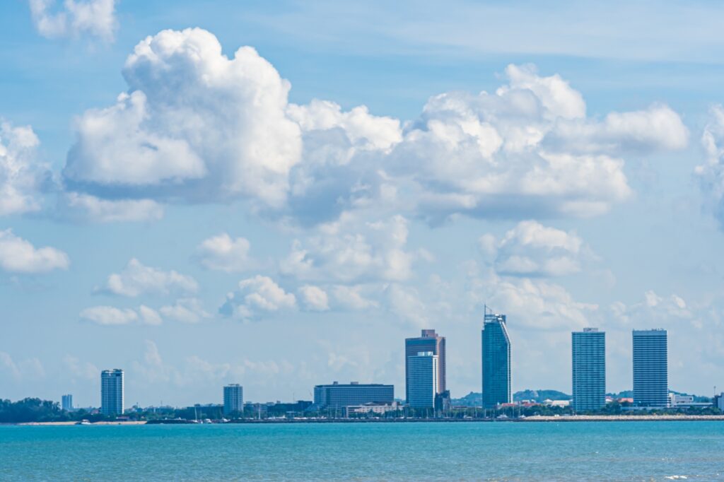 Beautiful landscape of sea with Pattaya cityscape and white clou