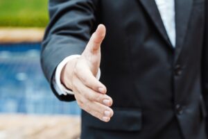 Business and office concept - Business man shaking hands in Luxury property