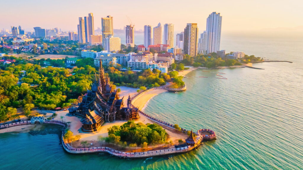 Sanctuary of Truth, Pattaya, Thailand, wooden temple by the ocean at sunset on the beach of Pattaya