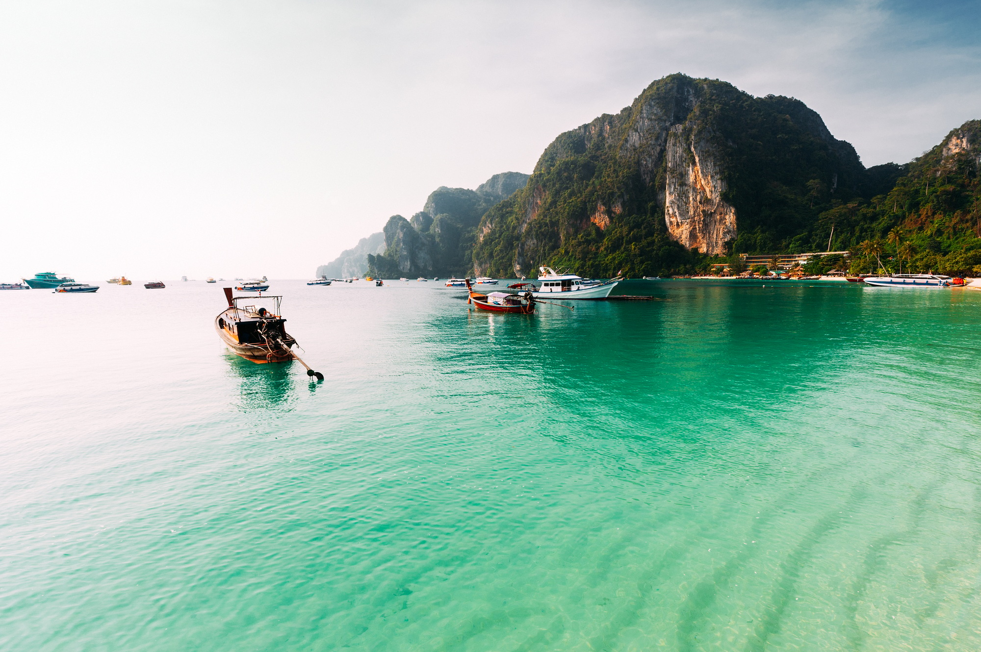 Laguna on the beautiful Thai Islands. Asian Islands. Thai Phi Phi Islands. Thai wooden boats