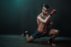 Muay Thai athlete training at Thai boxing indoors, ultimate fight concept