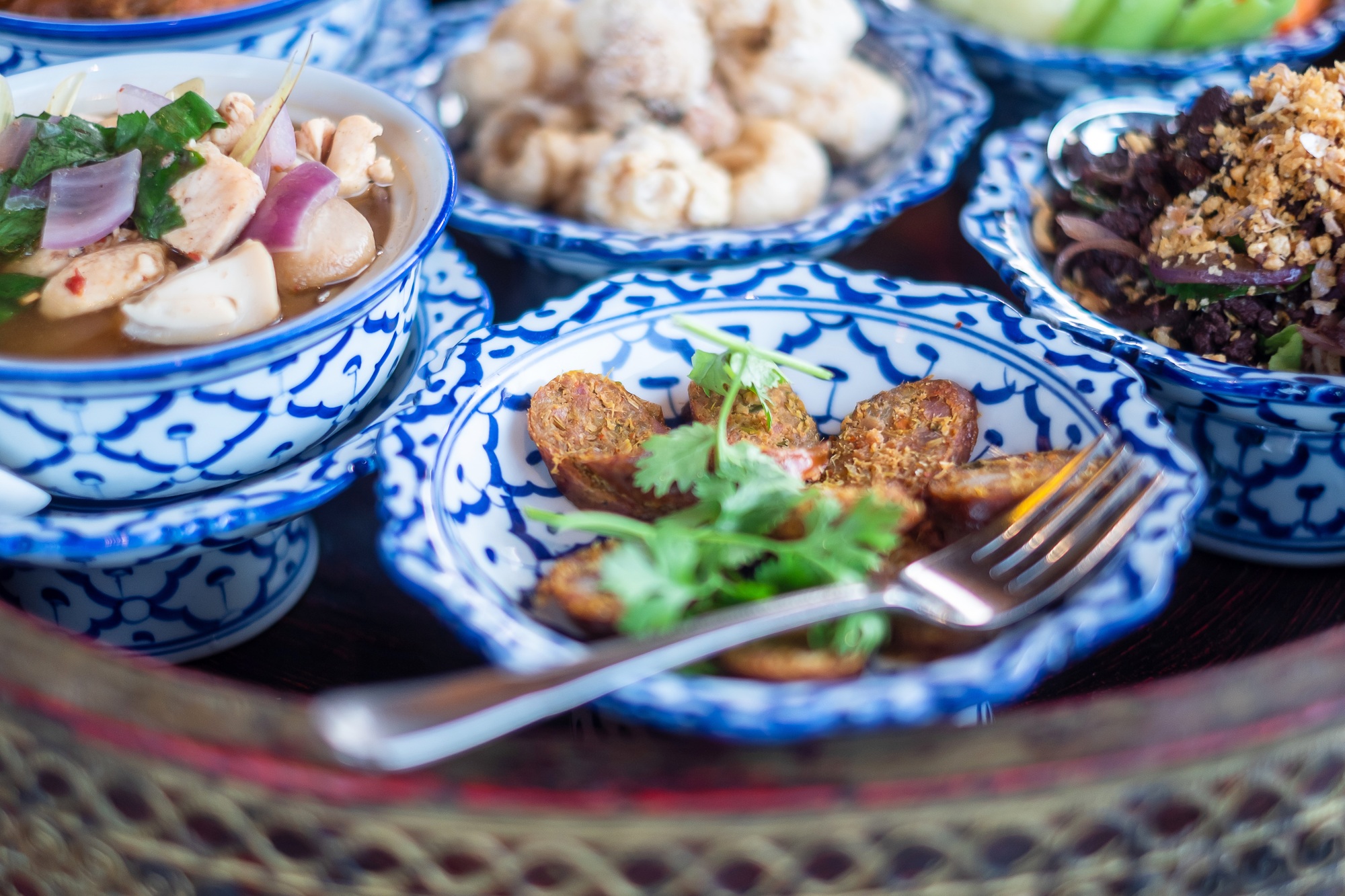 traditional Thai food on bamboo tray or Khan Toke, local food in Northern of Thailand