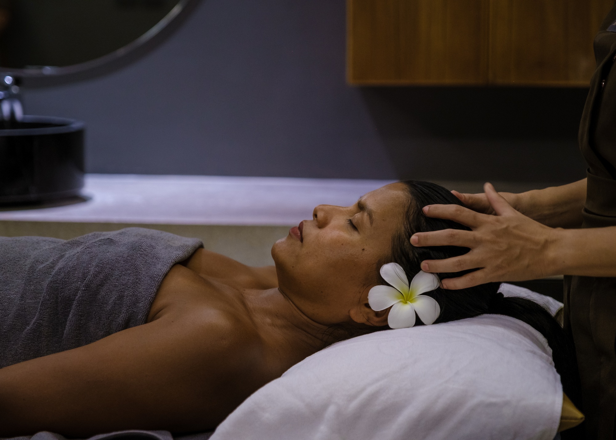 Asian woman getting Thai massage in a wellness