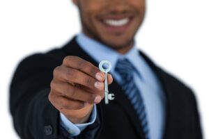 Businessman showing new house key