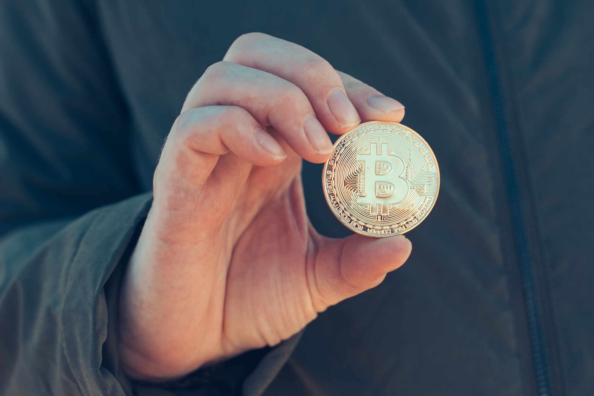 Woman holding Bitcoin BTC cryptocurrency